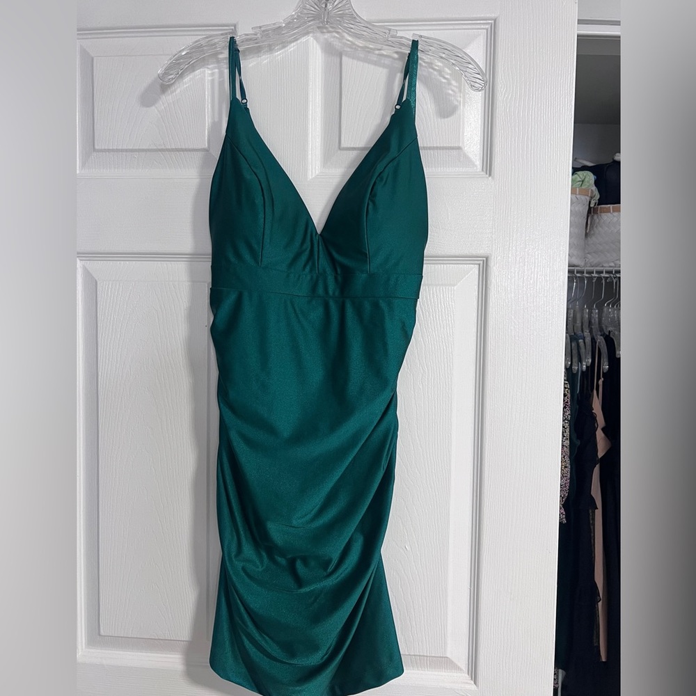 Ruched back emerald green cocktail dress.
